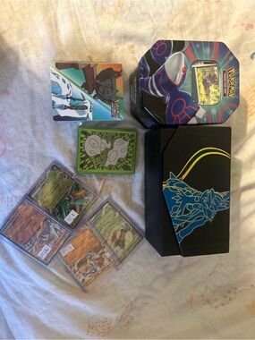 Pokémon TCG Collector Bundle with Tin, Deck Box & Sleeves and more